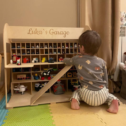 Toy car storage used by a child at play